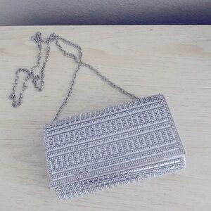 Silver clutch purse with silver strap